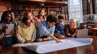Students and faculty collaborating in a learning space.