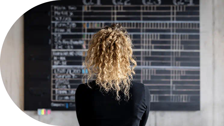 Woman looking at board