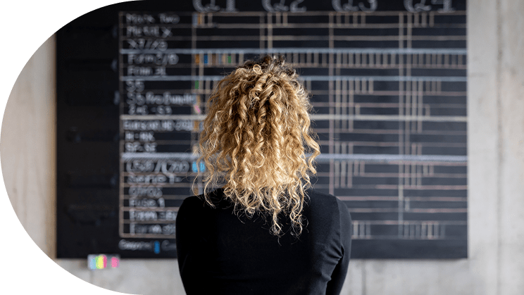 Woman looking at board