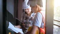 two-construction-workers-looking-at-plan