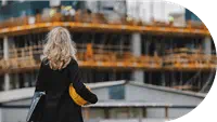 Woman looking at cargo ship