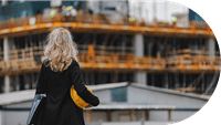 Woman looking at cargo ship