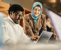man-and-woman-looking-at-laptop