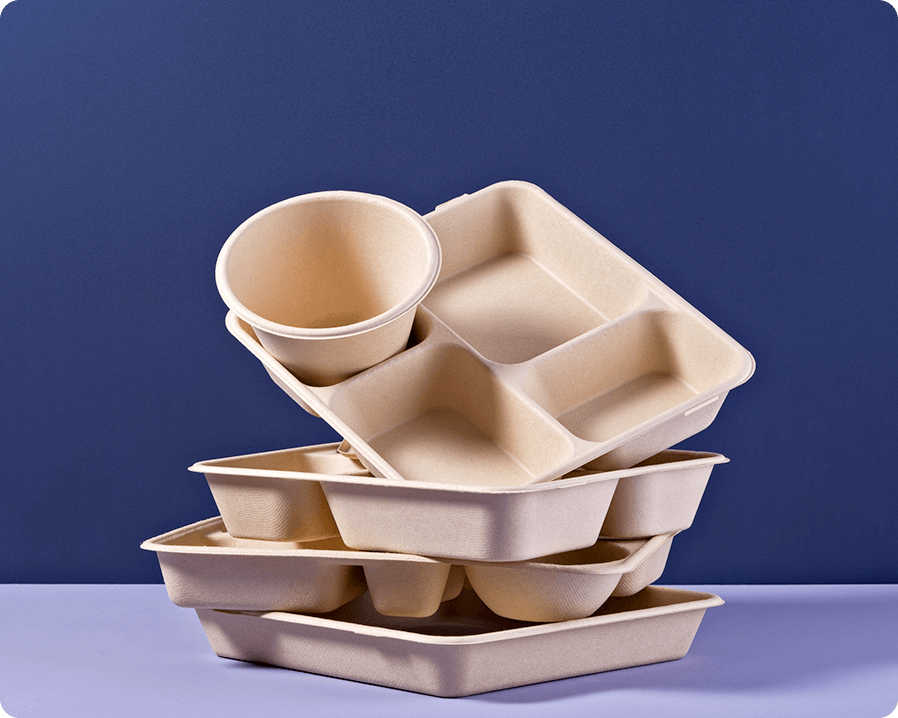 Disposable trays of various shapes stacked on top of each other