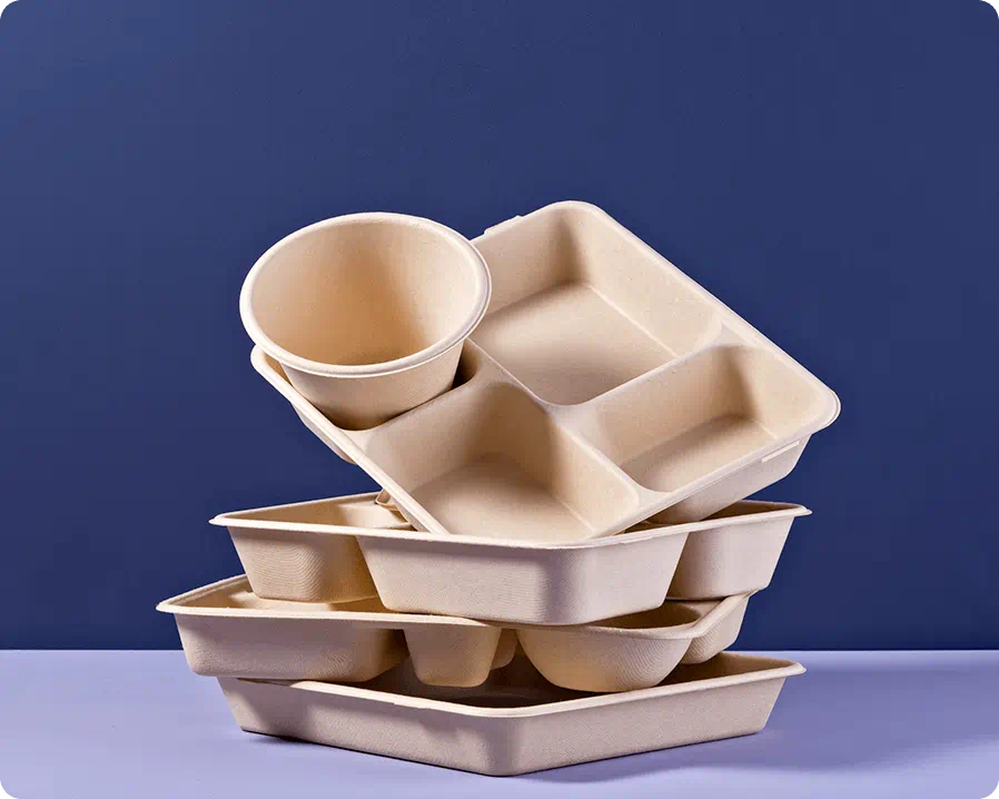 Disposable trays of various shapes stacked on top of each other
