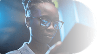 woman-in-glasses-looking-at-tablet