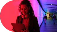 woman-with-headphones-around-neck-looking-down