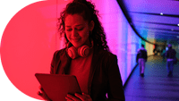 woman-with-headphones-around-neck-looking-down