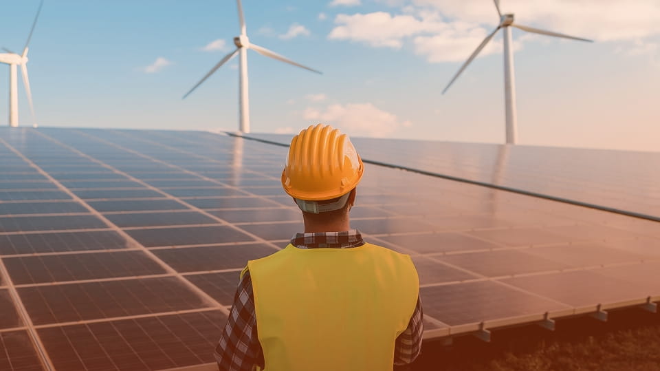 construction-worker-looking-at-windmills