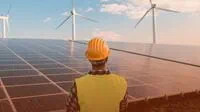 construction-worker-looking-at-windmills