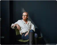 Woman sitting with boots