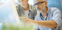 man-and-woman-looking-at-computer