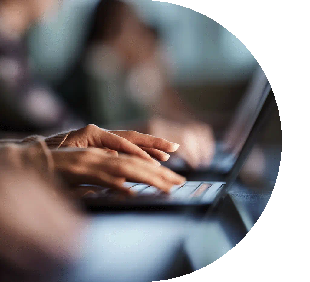 hands typing on a keyboard