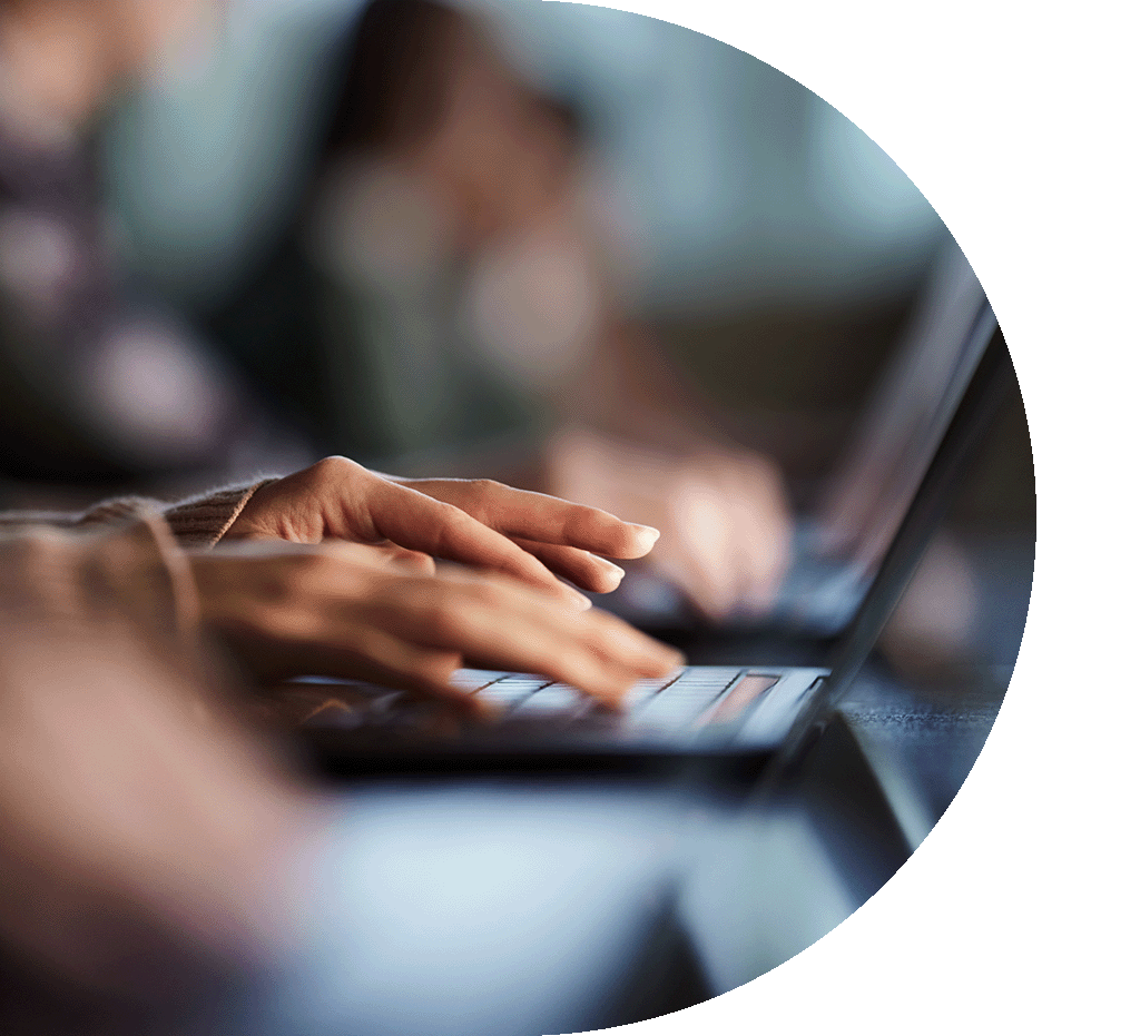 hands typing on a keyboard