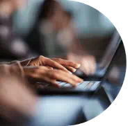 hands typing on a keyboard