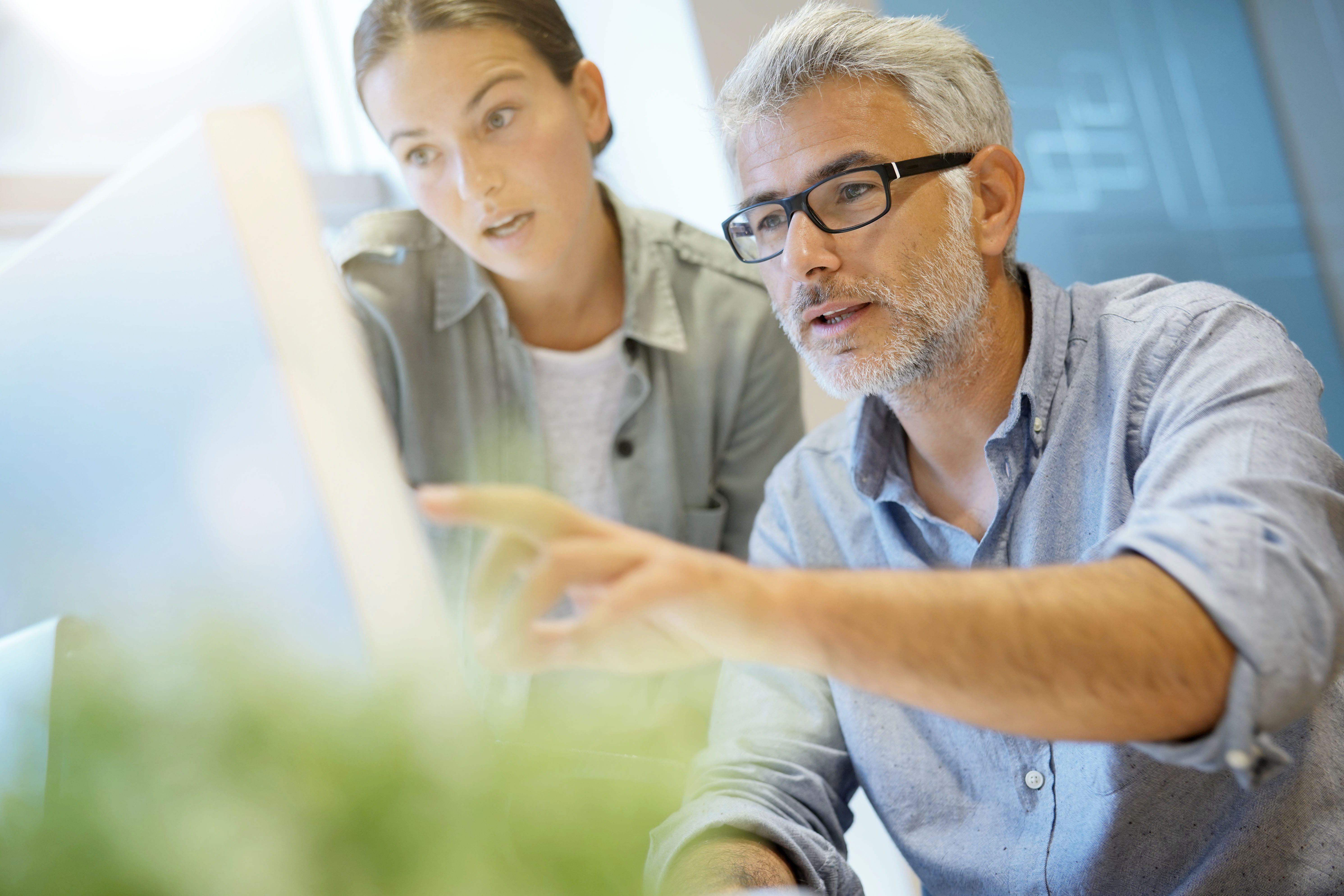 man-and-woman-looking-at-computer