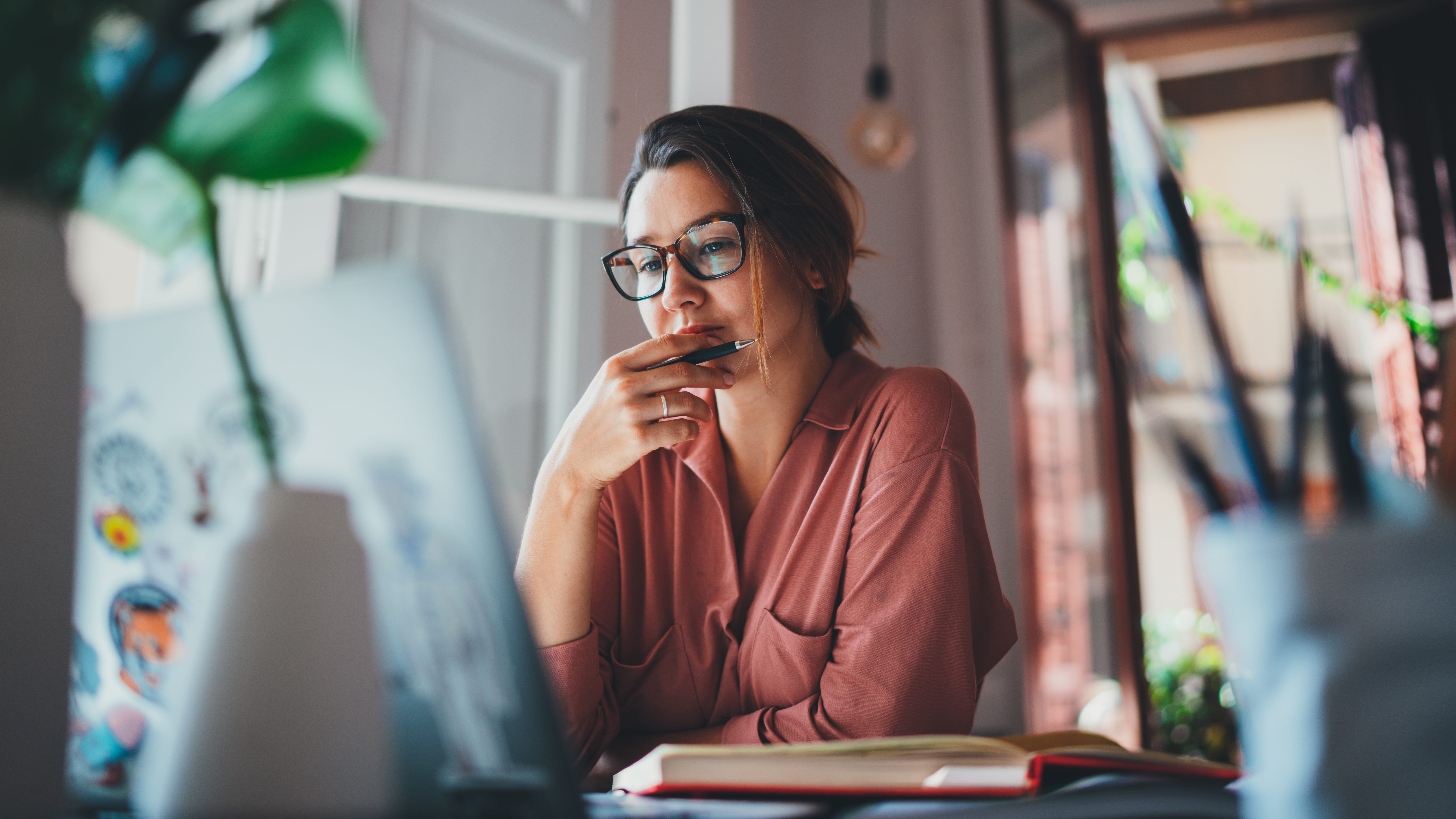 woman-pondering-at-desk