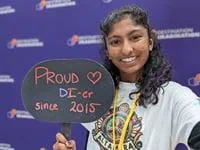 Nikhita Penugonda holding sign