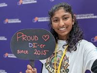 Nikhita Penugonda holding sign