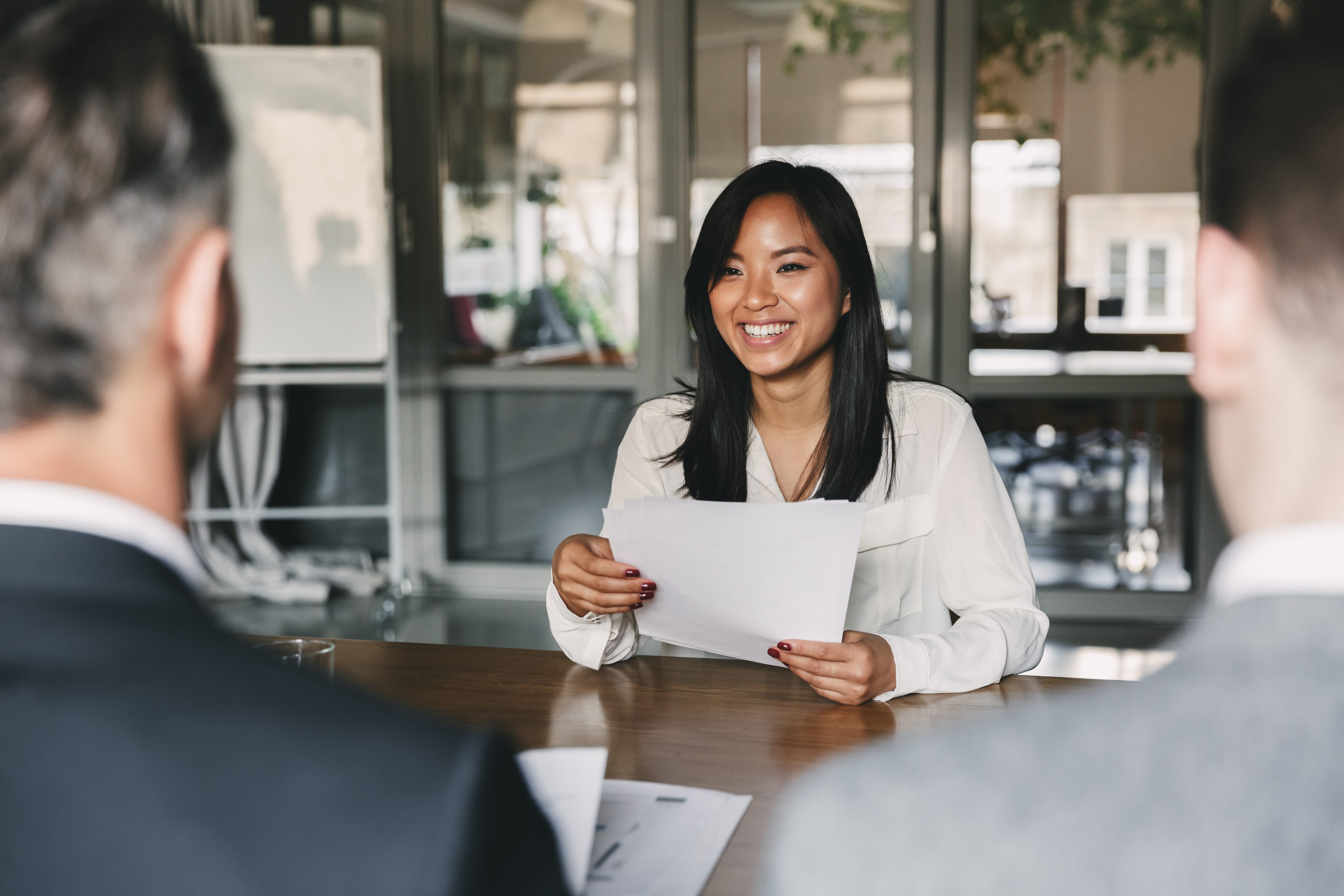 woman-smiling-at-table