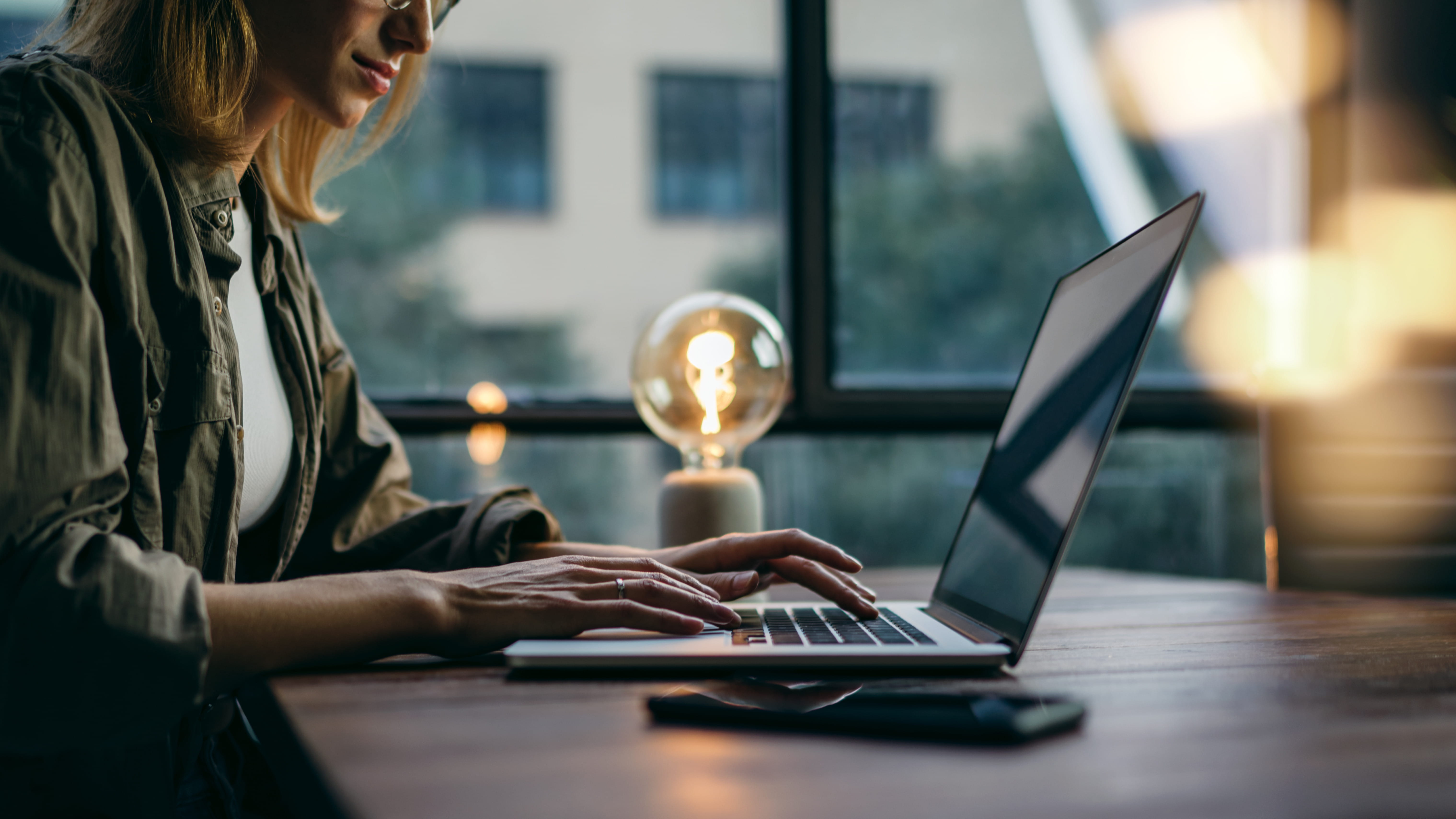 woman-working-at-desk-on-computer