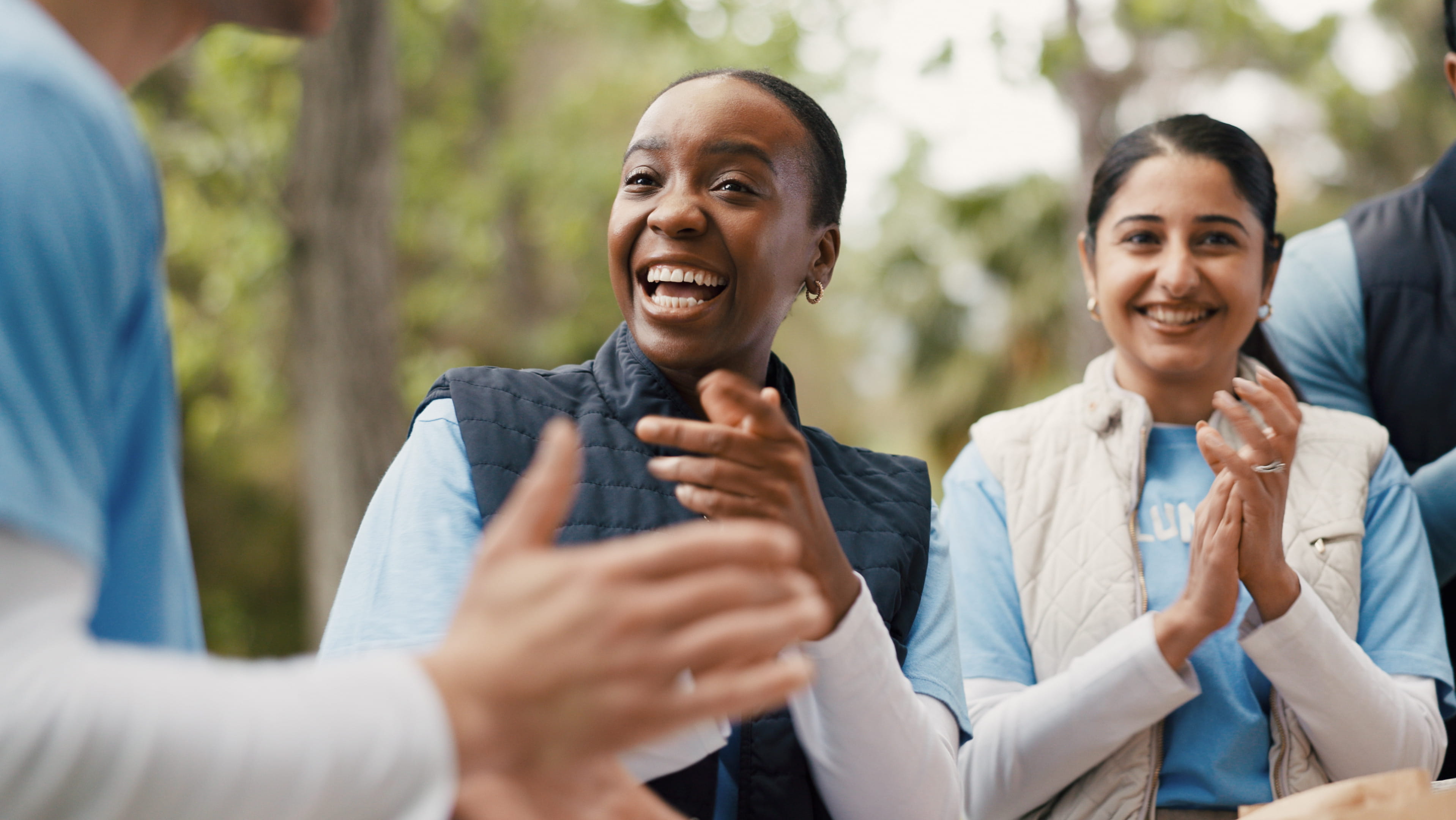 two-women-smiling-and-clapping