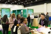 attendees-standing-at-booth
