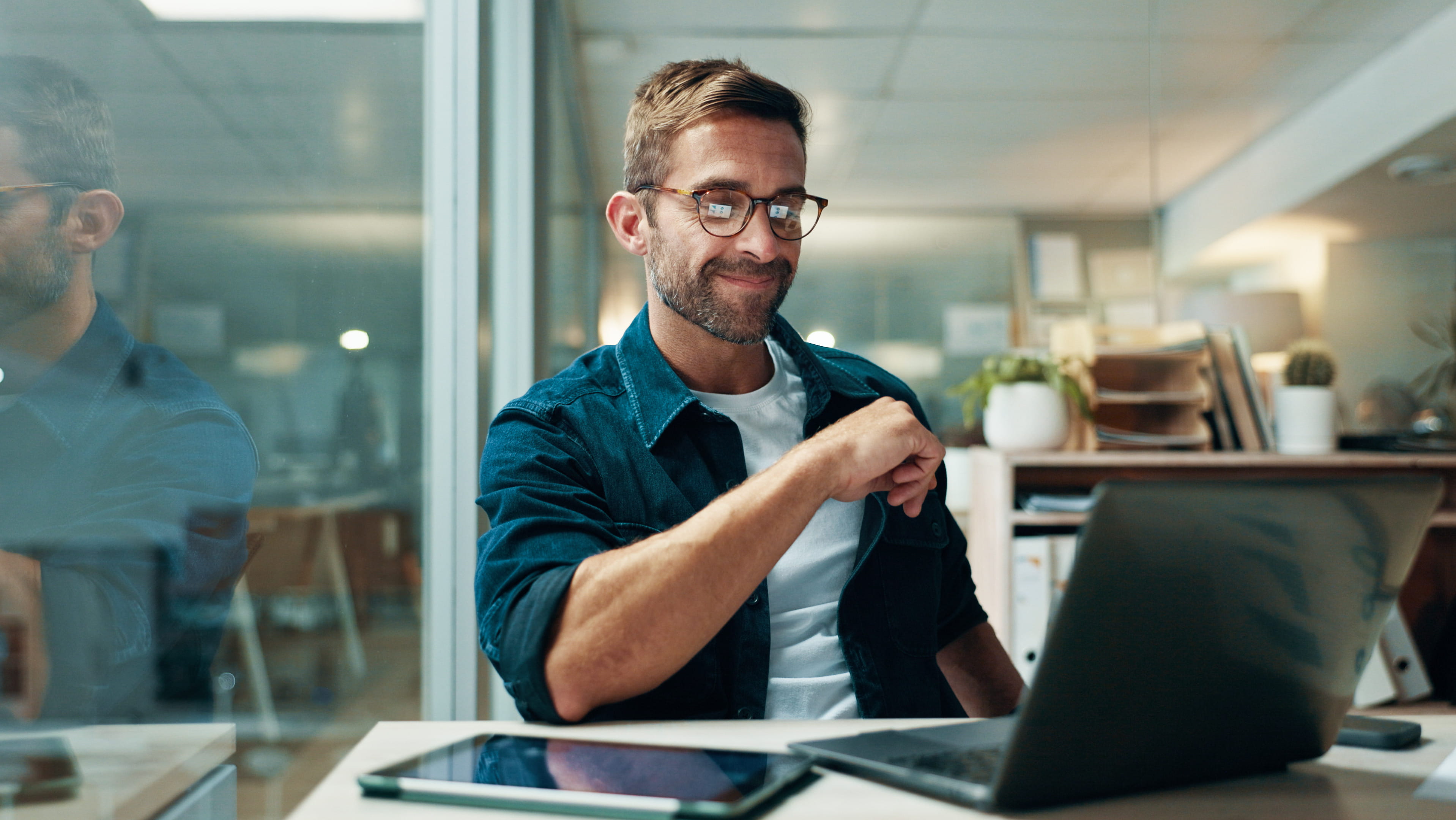man-sitting-at-computer-pondering
