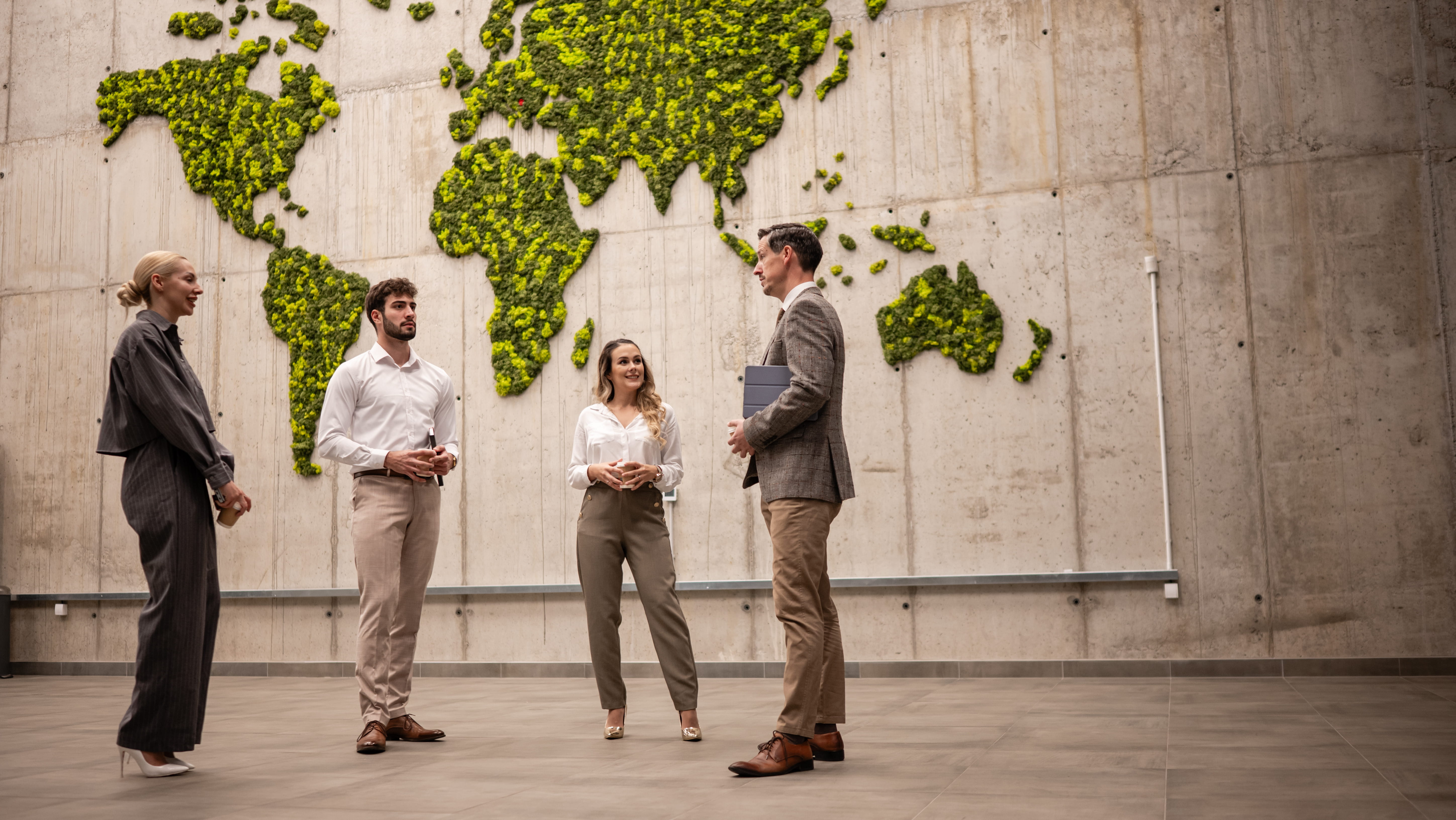 people-standing-in-front-of-world-globe-in-background