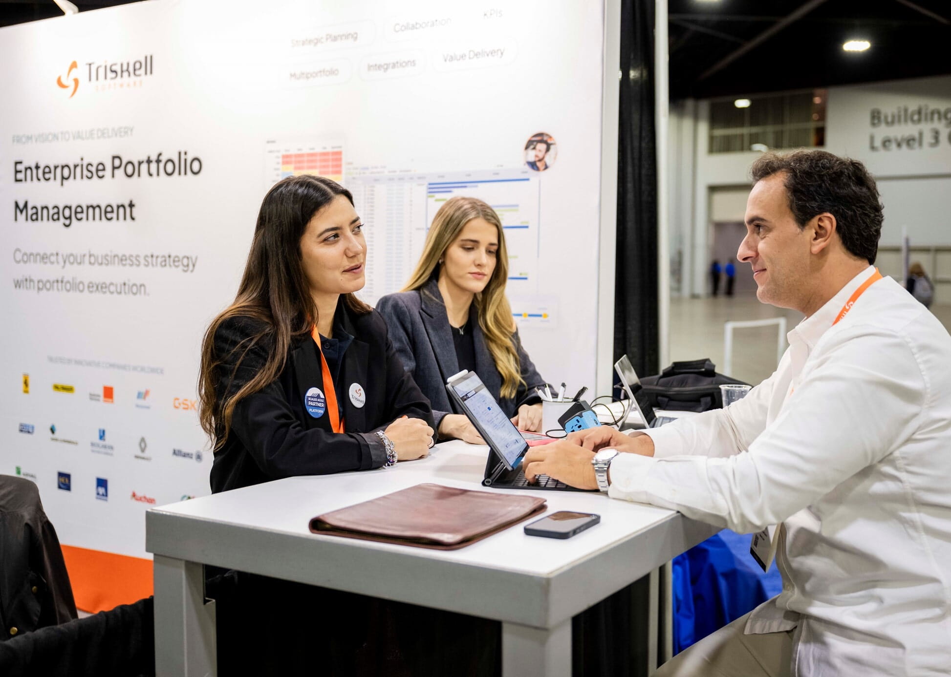 Three people sitting at a table and talking