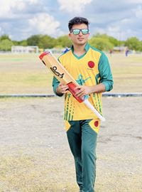 Mansoor Wahdat holding baseball bat