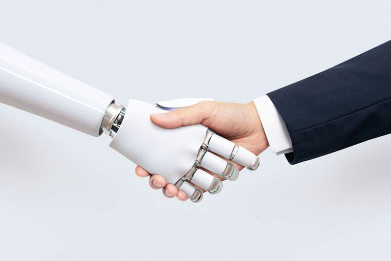 The Hub article, robot and human handshake