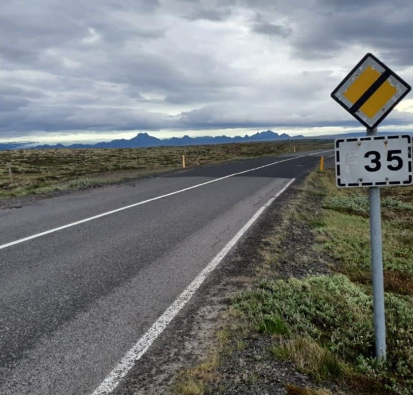 The Hub article, picture of an empty road with a speed limit sign