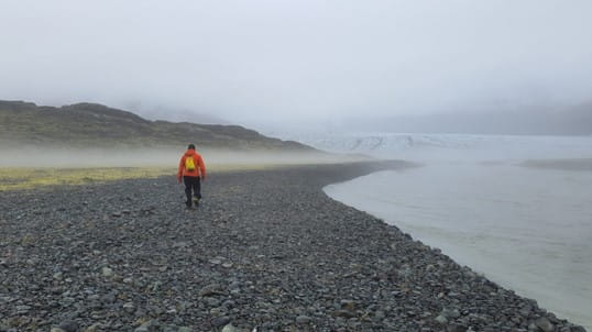Man walking along the ocean