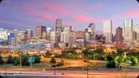Denver skyline with the mountains in the distance.