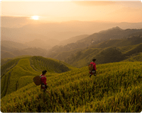 two people walking in mountains sunrise