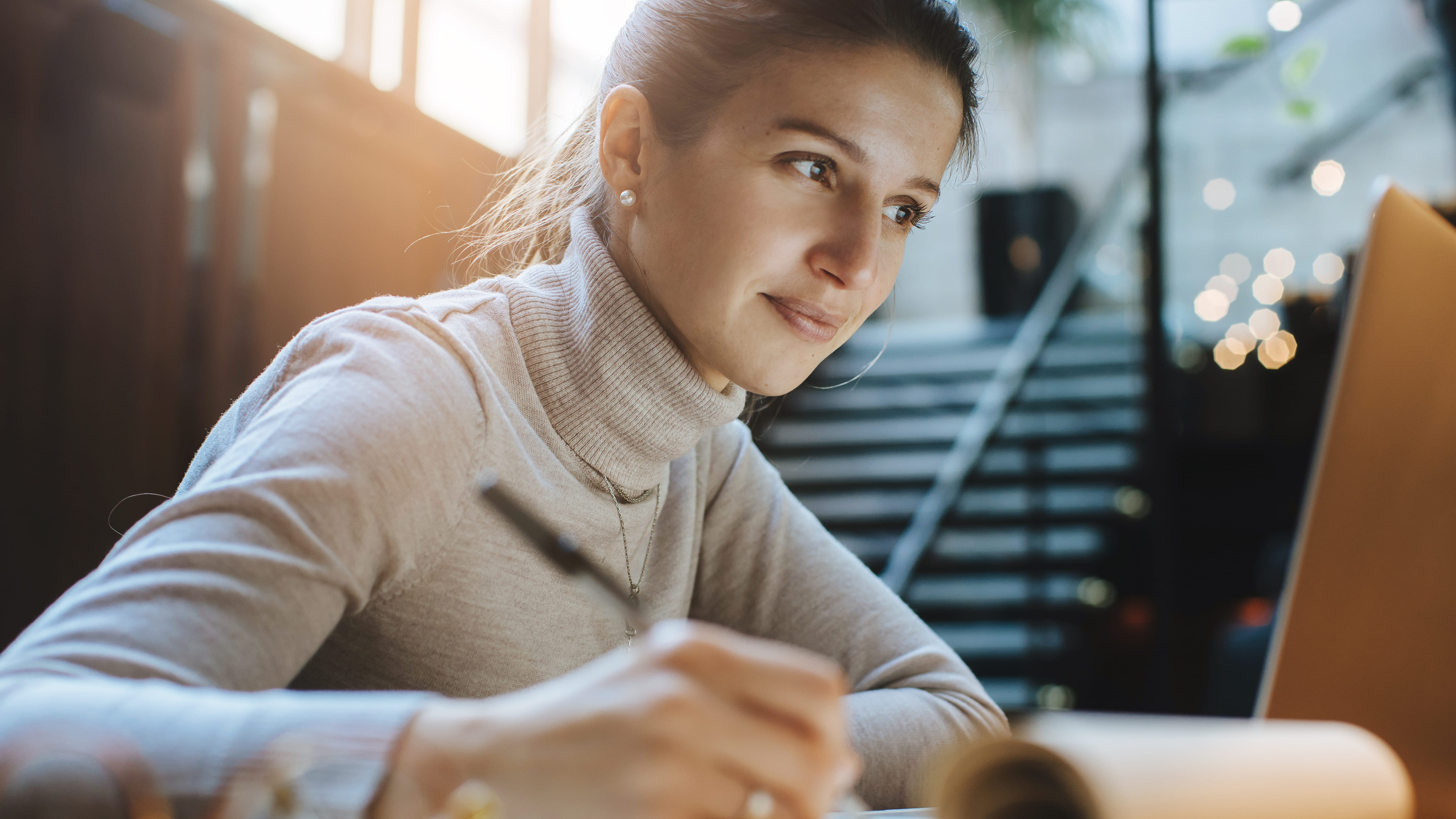woman-writing-at-desk