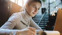 woman-writing-at-desk