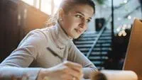 woman-writing-at-desk