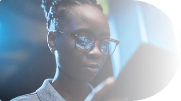 woman-in-glasses-looking-at-tablet