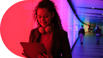 woman-with-headphones-around-neck-looking-down