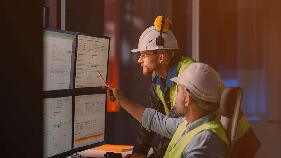 construction-workers-looking-at-computer