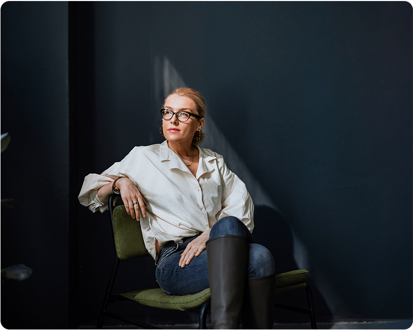 Woman sitting with boots