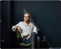 Woman sitting with boots