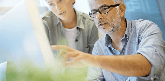 man-and-woman-looking-at-computer