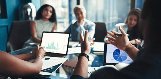 people-looking-at-laptops-with-charts