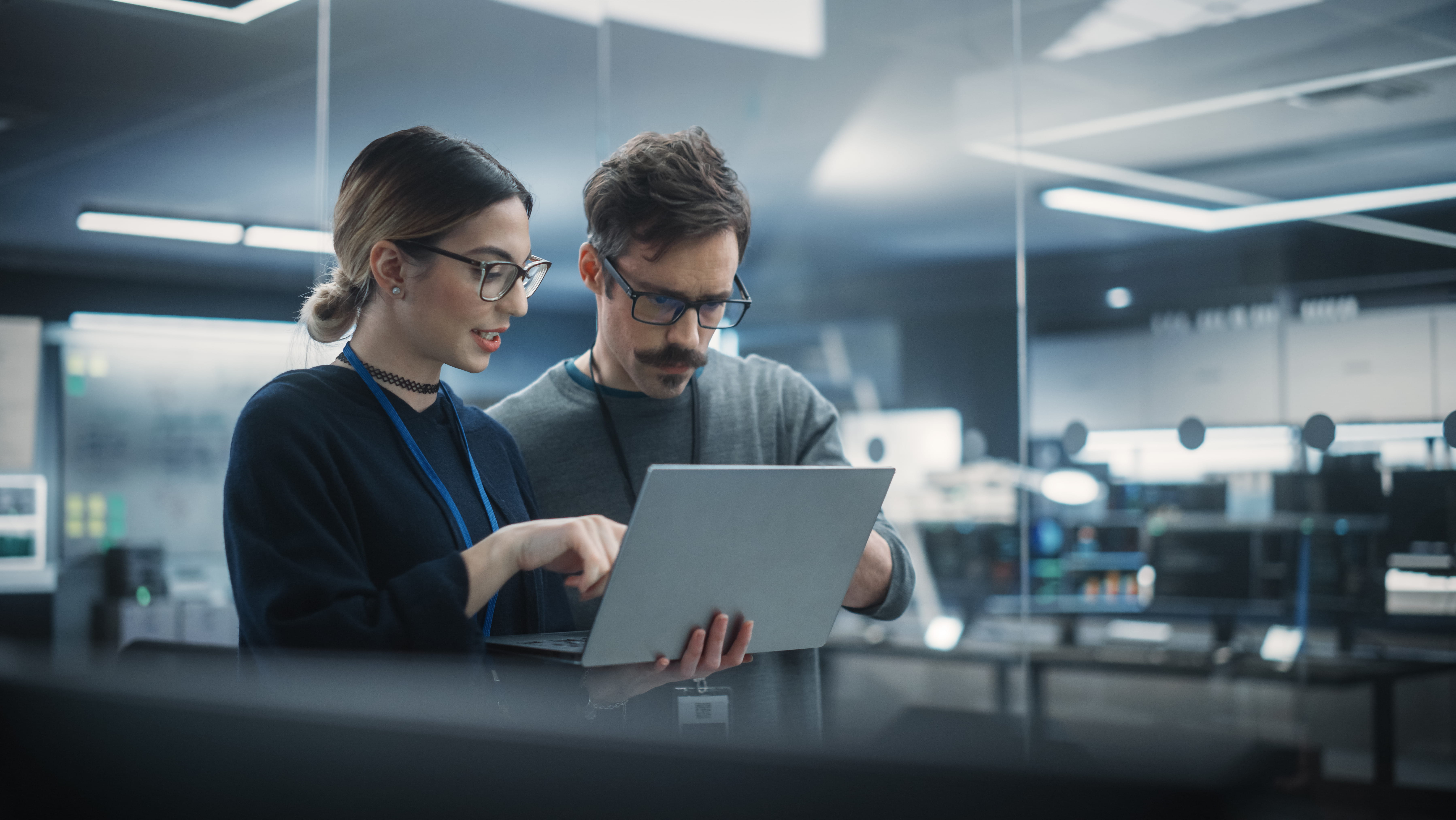 two-people-looking-at-laptop