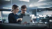 two-people-looking-at-laptop