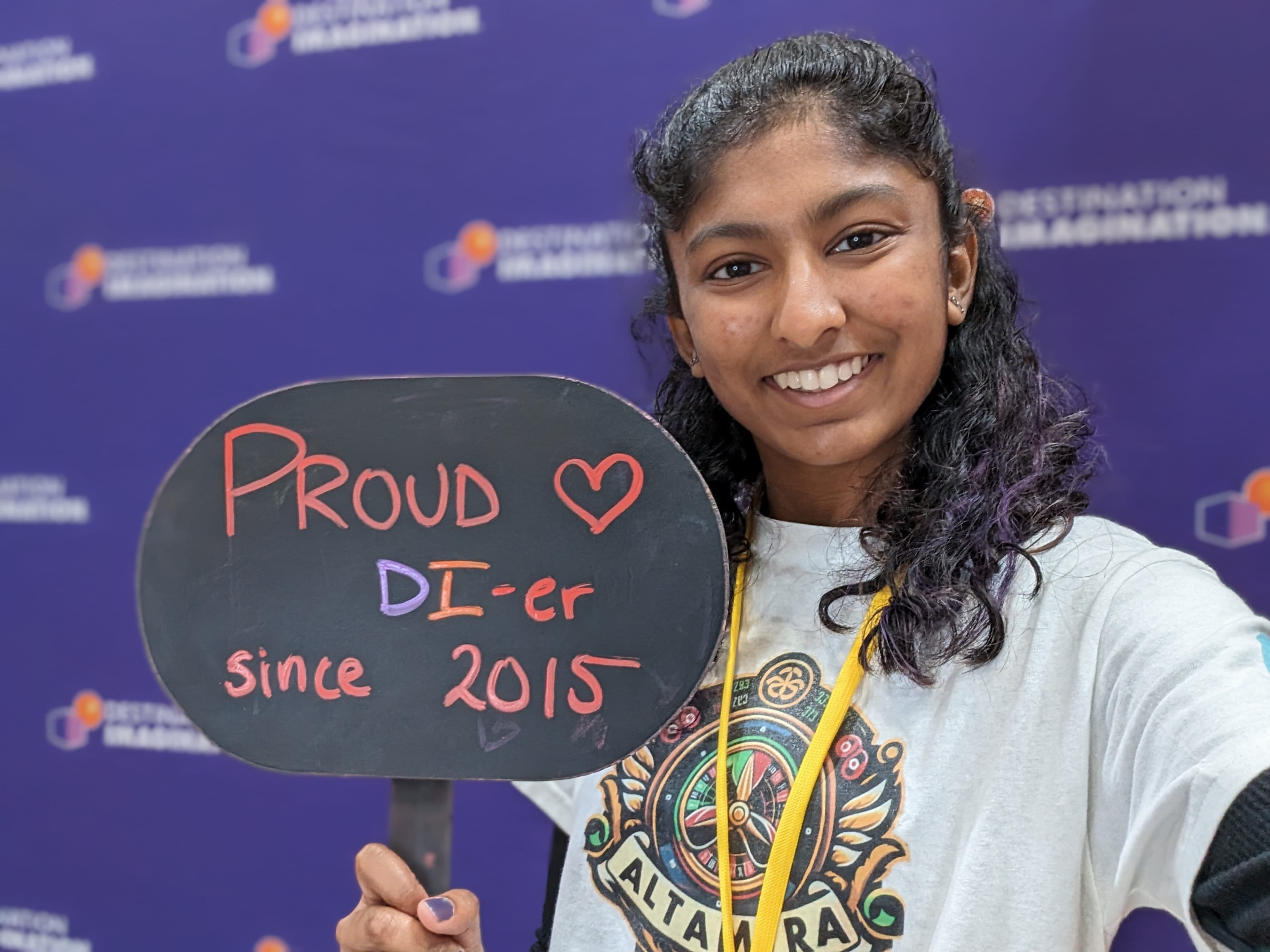 Nikhita Penugonda holding sign