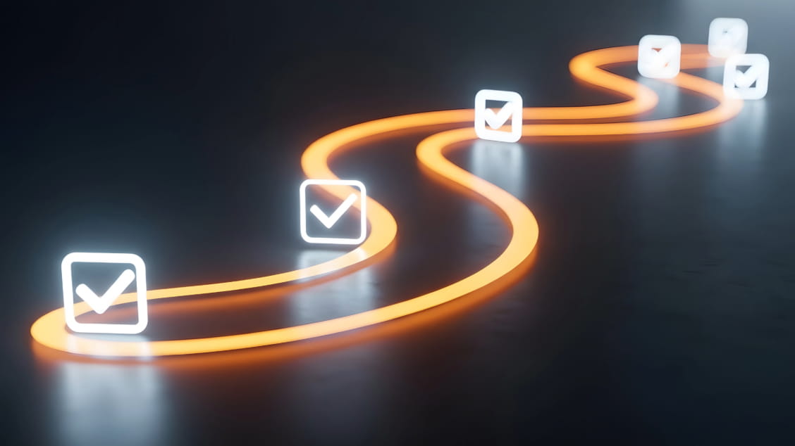 white-check-boxes-along-squiggily-orange-line